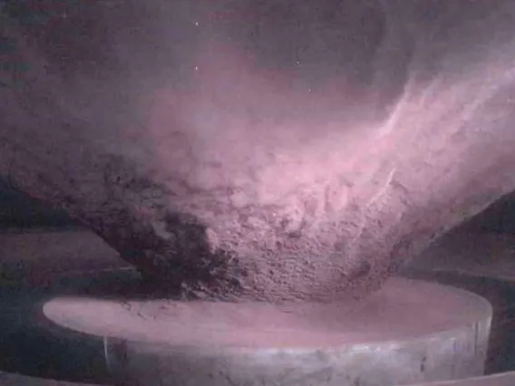 Side view of the ejecta curtain created during a hypervelocity impact experiment at the NASA Ames Vertical Gun Range