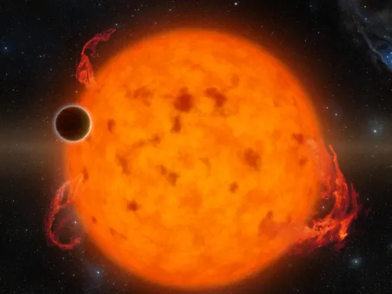 This artist's concept shows the exoplanet K2-33b transiting its host star.