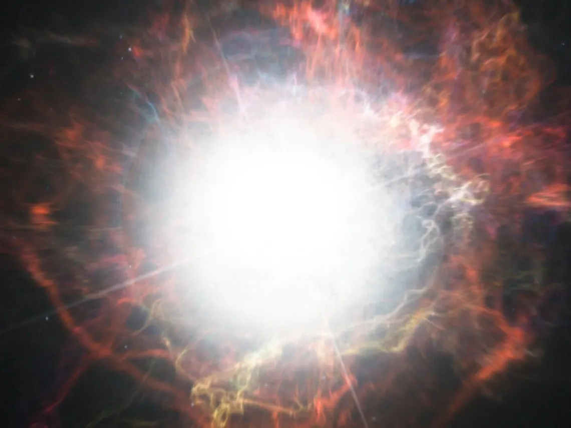 This artist’s impression shows dust forming in the environment around a supernova explosion