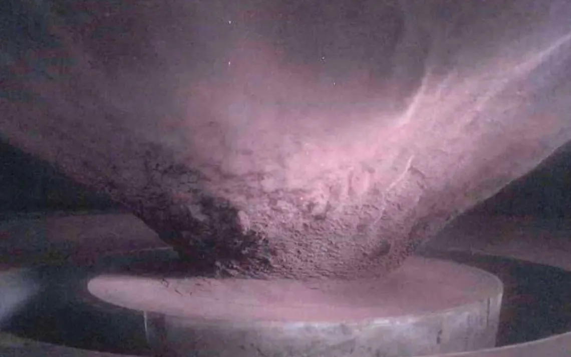 Side view of the ejecta curtain created during a hypervelocity impact experiment at the NASA Ames Vertical Gun Range