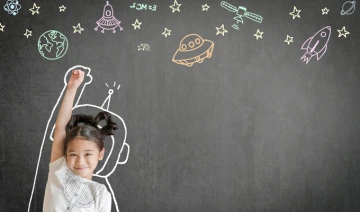 Creative innovation educational conceptual idea with happy little asian girl kid in astronaut suit doodle drawing